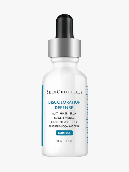 SkinCeuticals Discoloration Defense Serum in branded white bottle with silver and black pipette on light gray background
